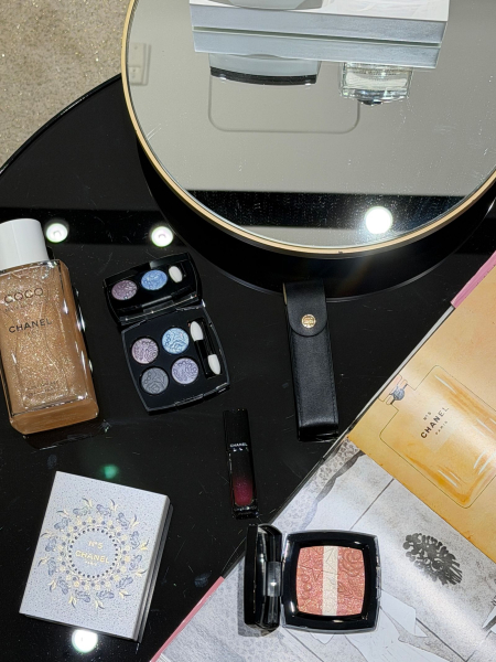 flat lay of products and a mirror at the Chanel store